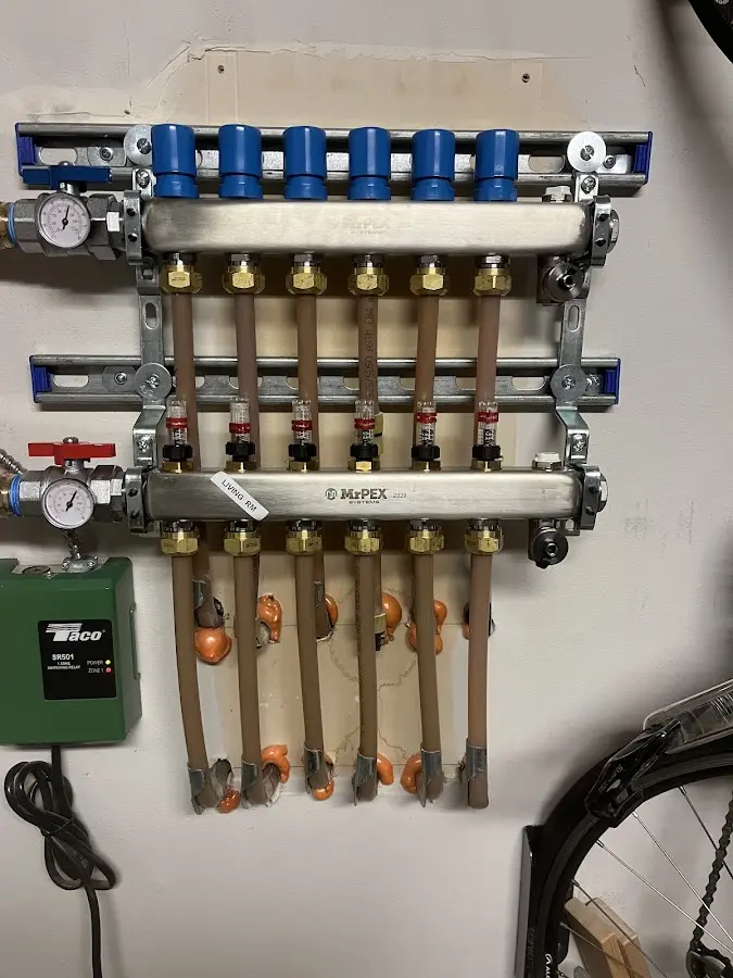 Plumber performing Gas Line Installation at a residential property in Brookline